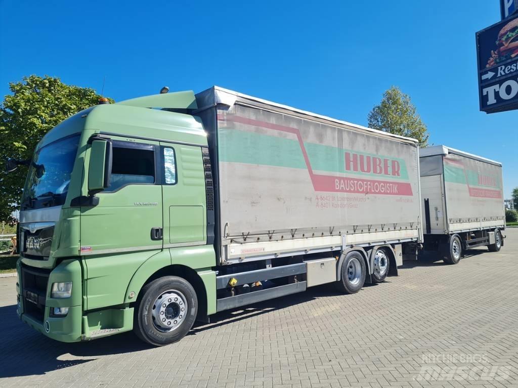 MAN 26.440  7.4 + 7.3 Curtain sider trucks