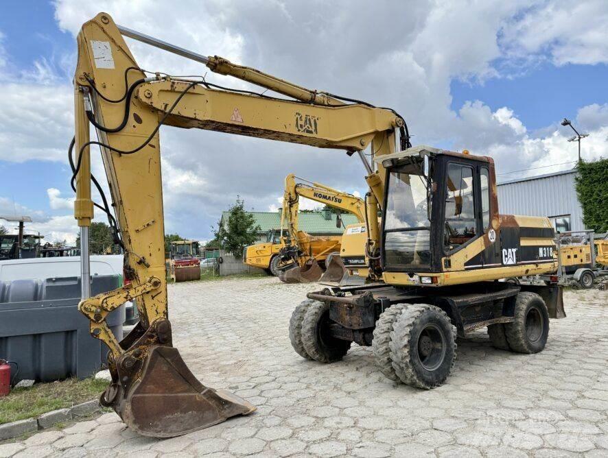 CAT M318 Wheeled excavators